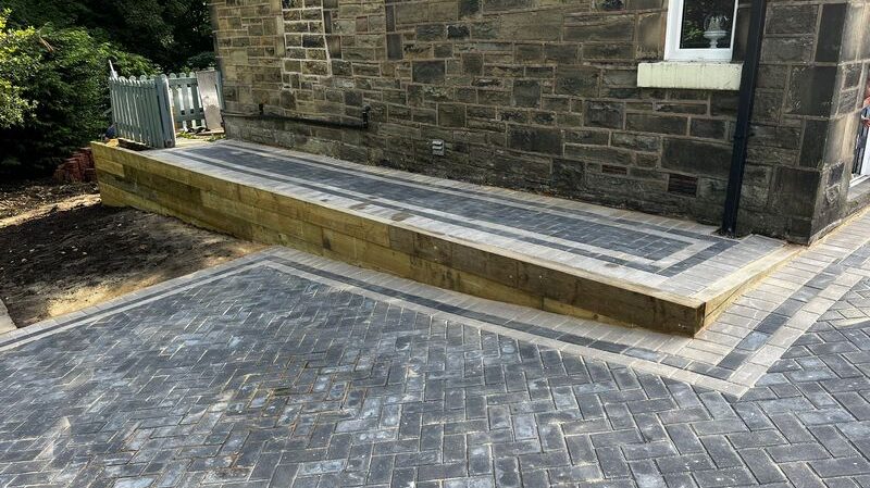 block paved driveway wooden railway sleepers retaining wall pathway 08