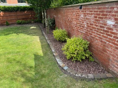 pink gravel flower bed brick edging preston 01