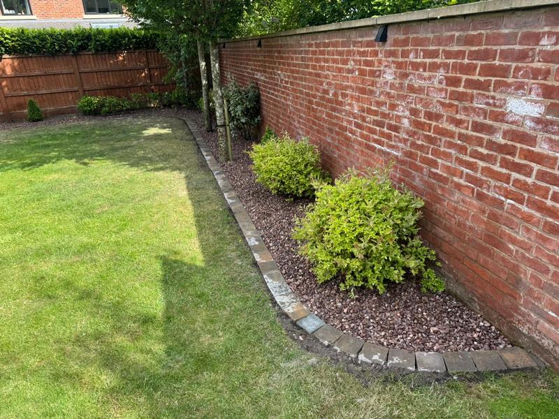 pink gravel flower bed brick edging preston 01
