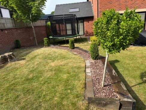 pink gravel flower bed brick edging preston 02