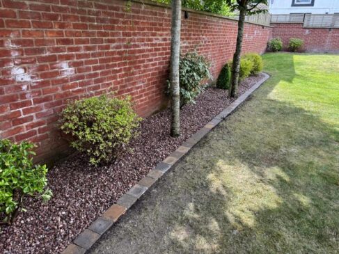 pink gravel flower bed brick edging preston 03